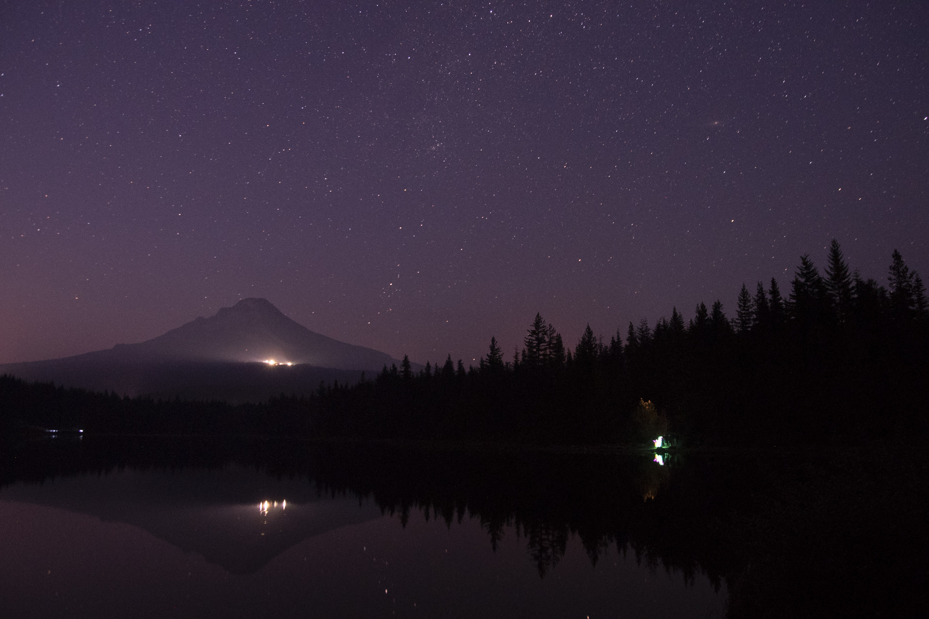 Barely 50 miles away from Portland, Oregon, stars twinkle above Mt. Hood around the campsites at Trillium Lake in August 2015.